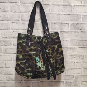 Brown and Black Shoulder Bag with Durable Fabric and Decorative Tassels